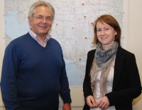 Professor Dr. Martin Diewald and Jana Noeller from Bielefeld's Faculty of Sociology who are running the new project Congrad. The flags on the map of the Western Balkans behind them mark the locations of the higher education institutions participating in the project.